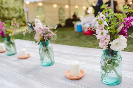 Rustic wedding centerpieces: mason jars with wildflowers