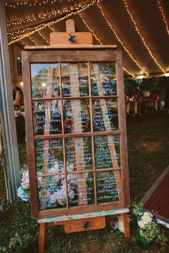 Rustic wedding seating chart on repurposed window