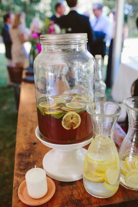 Lemonade and iced tea in glass jars at wedding