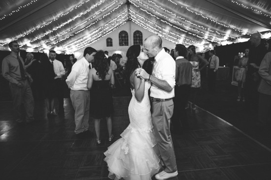 Wedding couple's first dance under fairy lights