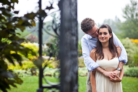 Loving couple embrace in a lush outdoor garden setting