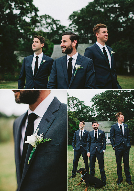 Groomsmen in suits at a wedding with a dog