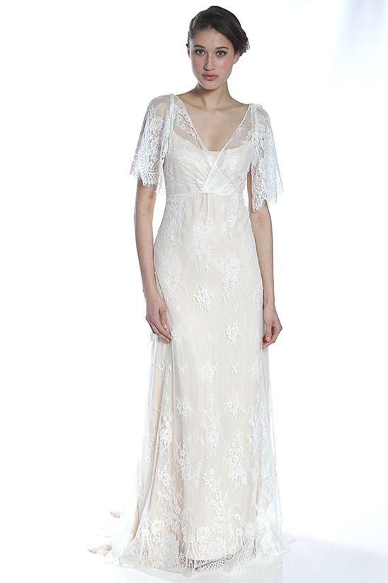 Woman wearing a lace wedding dress with short sleeves