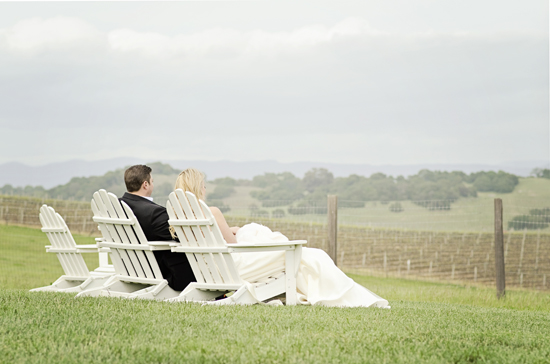 Couple in white chairs scenic view