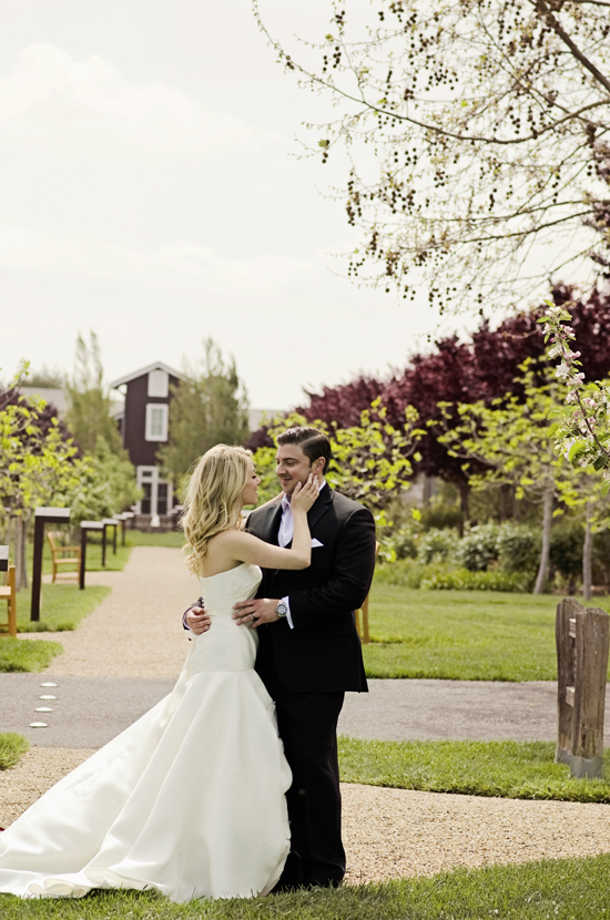 Couple in wedding attire, park setting