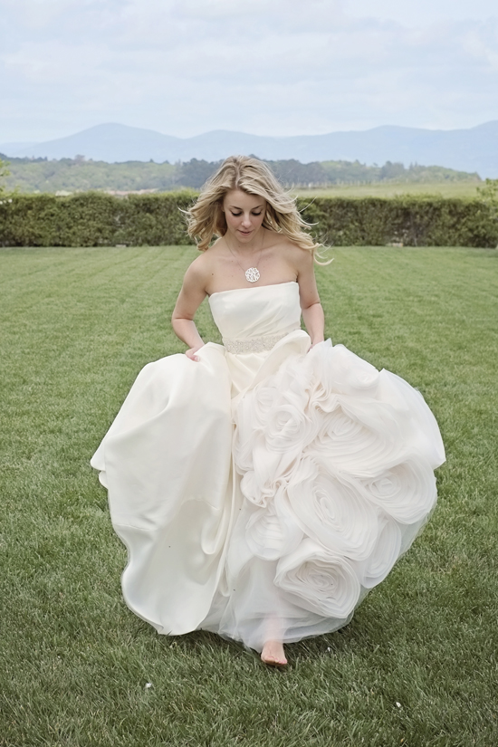 Woman in wedding dress on grass