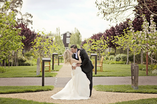 Couple kissing, wedding, garden setting