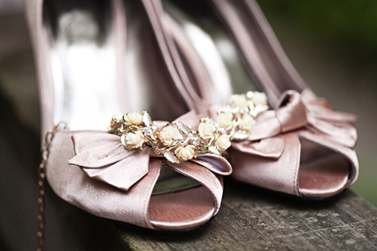 Elegant blush pink satin bridal heels with floral embellishments