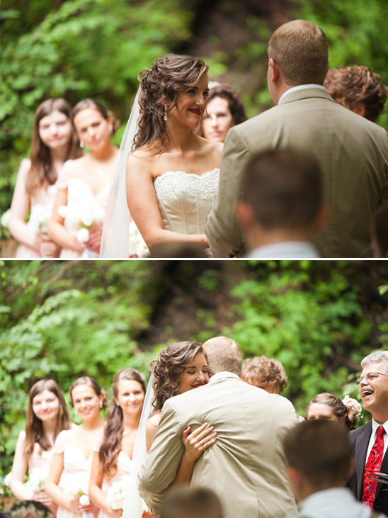 Bride and groom exchanging vows in a garden wedding