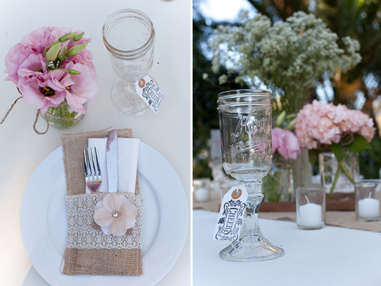 Rustic wedding table setting with mason jar glass and flowers