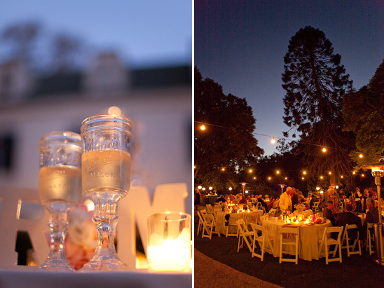 Outdoor wedding reception with champagne glasses and fairy lights