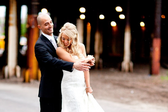 Happy bride and groom embrace on their wedding day