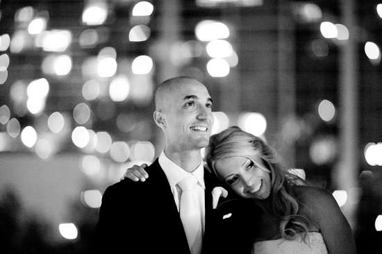 Happy bride rests on groom black and white wedding photo