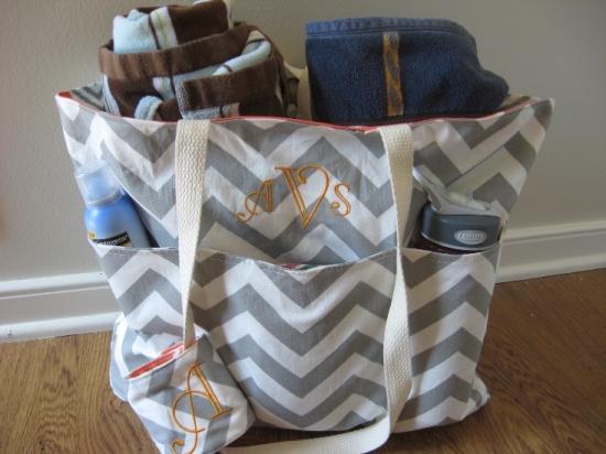 Chevron tote bag with towels and monogrammed initials