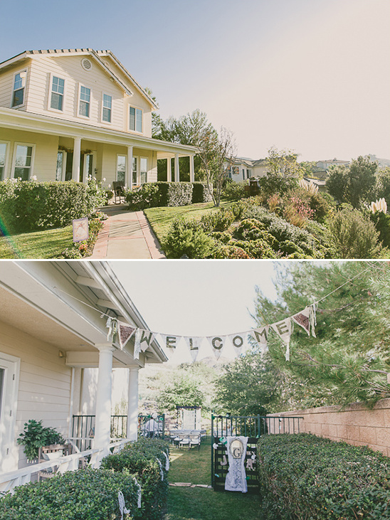 Outdoor wedding reception at charming house with welcome sign