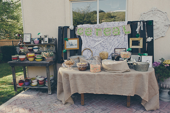 Outdoor breakfast bar with assorted cereal and colorful bowls