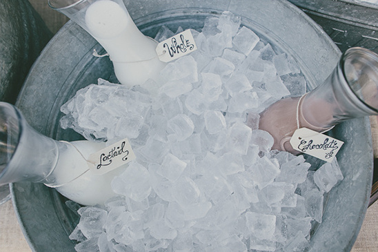 Milk bottles in ice bath with whole lactaid and chocolate tags