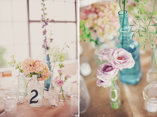 Rustic wedding table number two, pastel flowers in glass vases