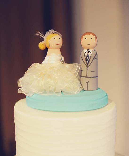 Adorable wooden bride and groom cake topper