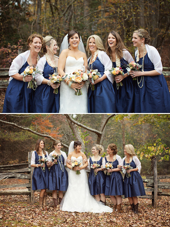 Bride with bridesmaids in navy dresses at outdoor wedding