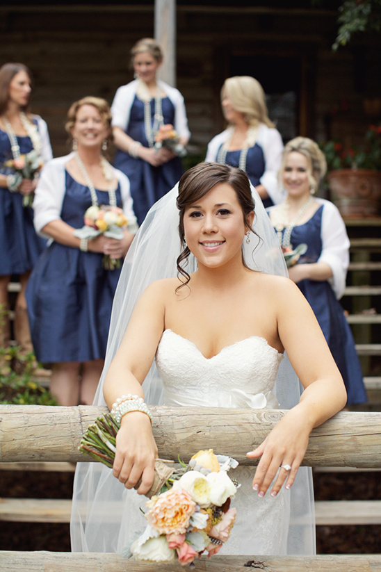 Bride and bridesmaids in navy dresses at wedding