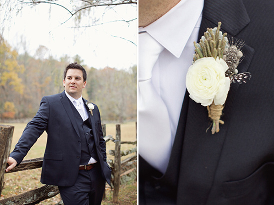Groom in navy suit with rustic boutonniere detail