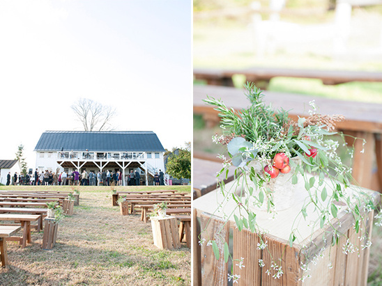 Rustic barn wedding ceremony setup with floral decor