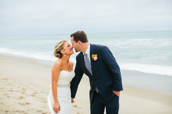 Bride and Groom share a tender moment at beach wedding