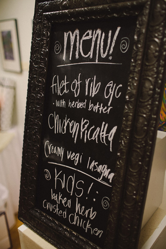 Handwritten chalkboard menu: rib eye, chicken, lasagna, kids' chicken