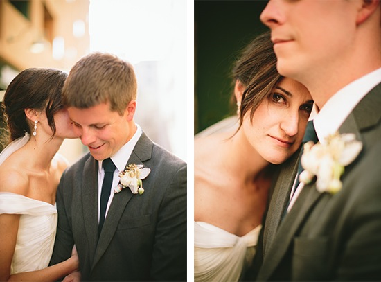 Bride whispering to groom at wedding reception