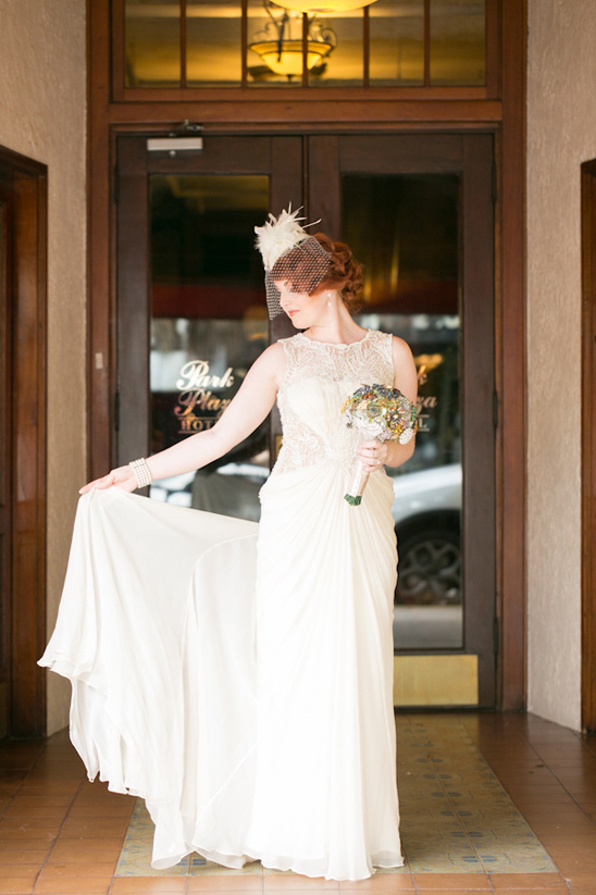Bride in vintage wedding dress holding bouquet