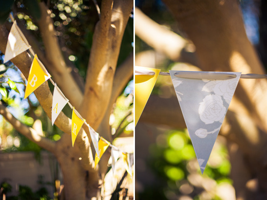 Yellow and gray baby shower banner hanging outdoors