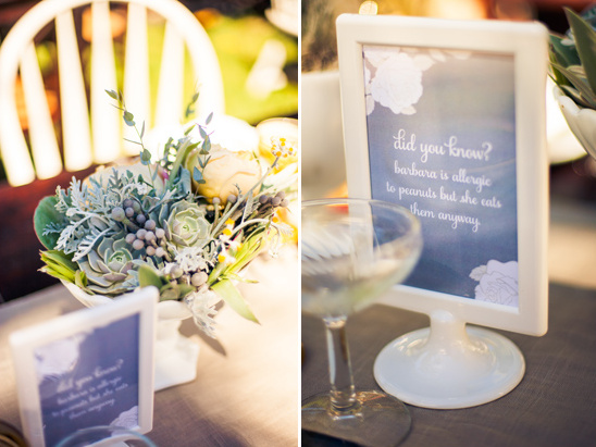 table signs with facts about the bride