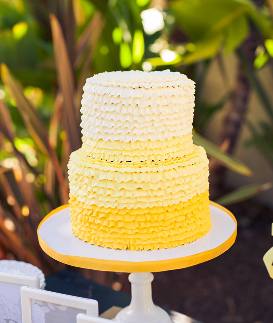 Yellow tiered ruffle cake with ombre design