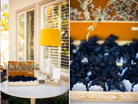 Yellow lamp, party favors, and vintage clocks decorate a table