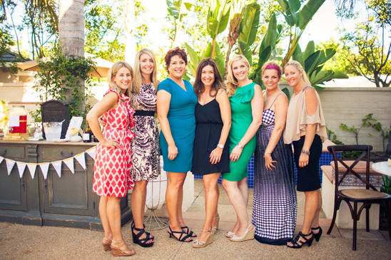 Group of women at an outdoor party in dresses