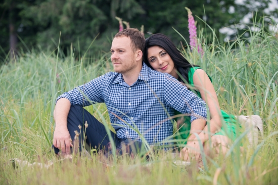 Happy couple embracing in a grassy field