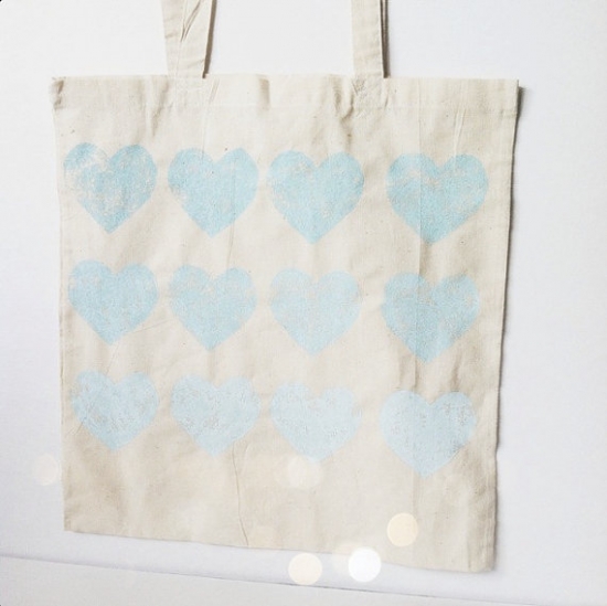 Canvas tote bag with rows of light blue hearts design