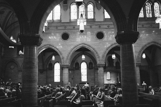Interior of a historic church, black and white photo with arches and light