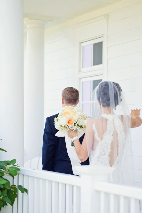 Bride approaches groom for first look wedding day