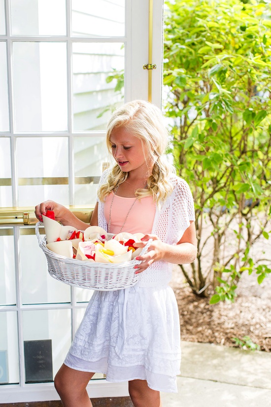 Girl holding flower petals in basket