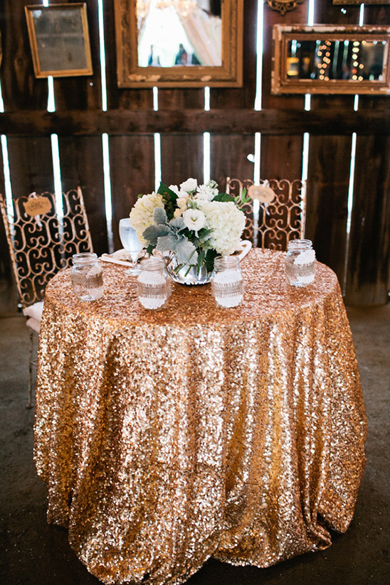 sweetheart table with gold tablecloth
