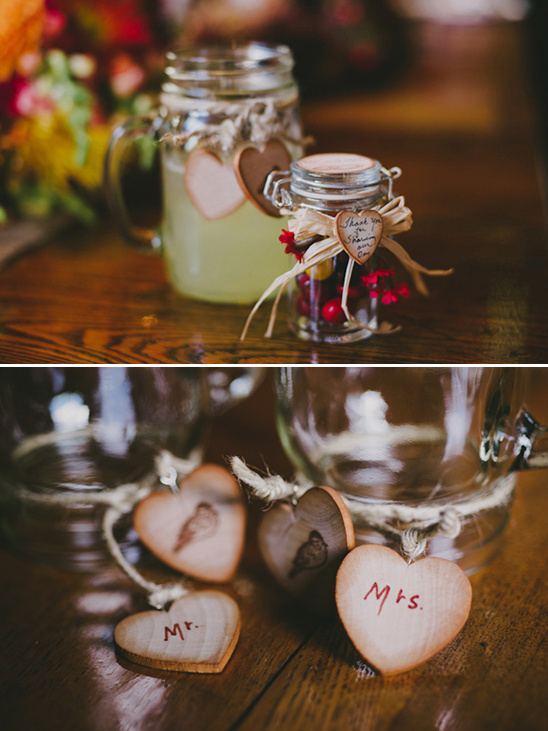 Wedding decorations with hearts and mason jars on a wooden table