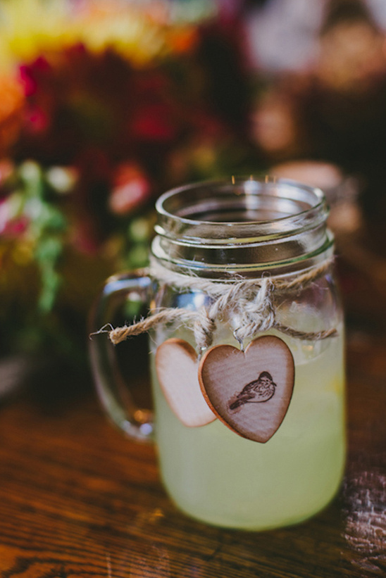 Refreshing drink in jar with heart charms and bird design