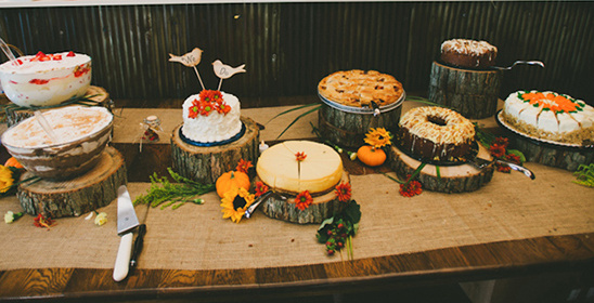 A rustic dessert table featuring a variety of delicious cakes