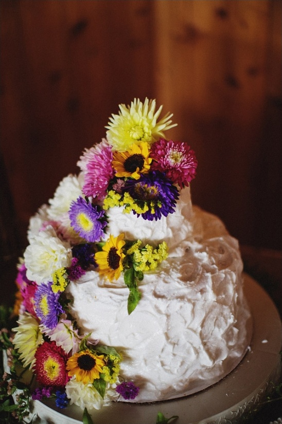 white wedding cake with wildflowers