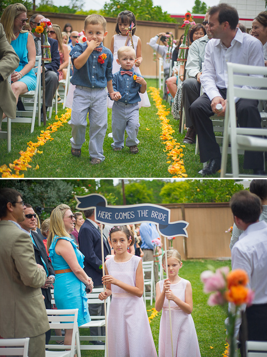 Wedding procession with children walking down the aisle before the bride