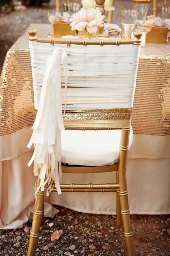 Gold chair with white fabric accents