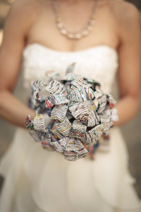 Bride holding a unique wedding bouquet made of paper