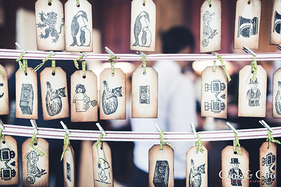 Vintage style gift tags with various whimsical illustrations hanging